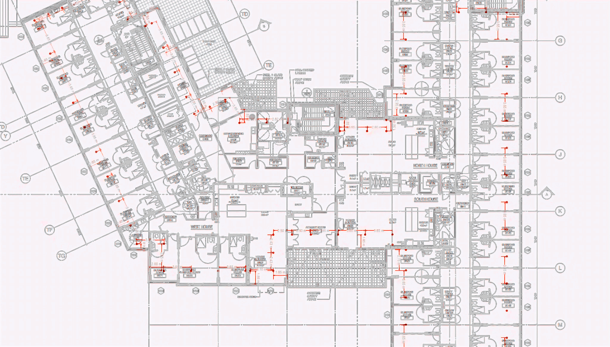 Architectural drawing with the Metro Safety Rail perimeter guardrail — red cable line and stanchion markers — traced around the slab edge of a full floor plate.